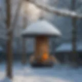 A heated bird feeder in a snowy garden, attracting various birds