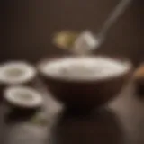 Coconut oil in a small bowl with a spoon beside it